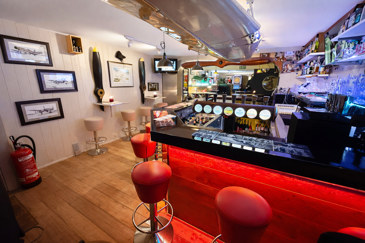 Guests enjoying drinks in the intimate wooden-house bar