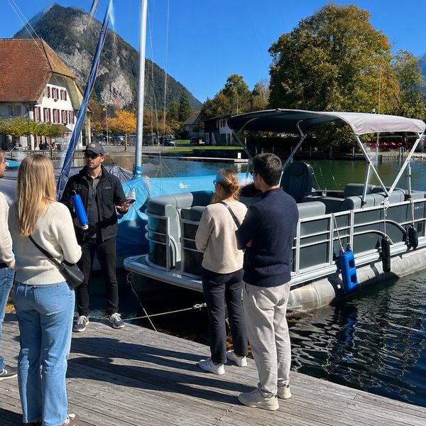 Group boarding the SunChill pontoon at the dock