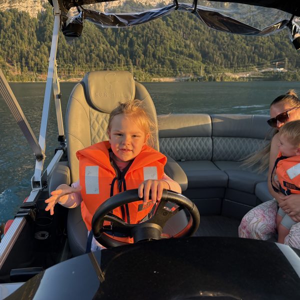 Young captain at the helm with the crew