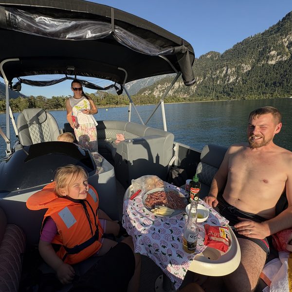 Family feast on the pontoon with alpine views
