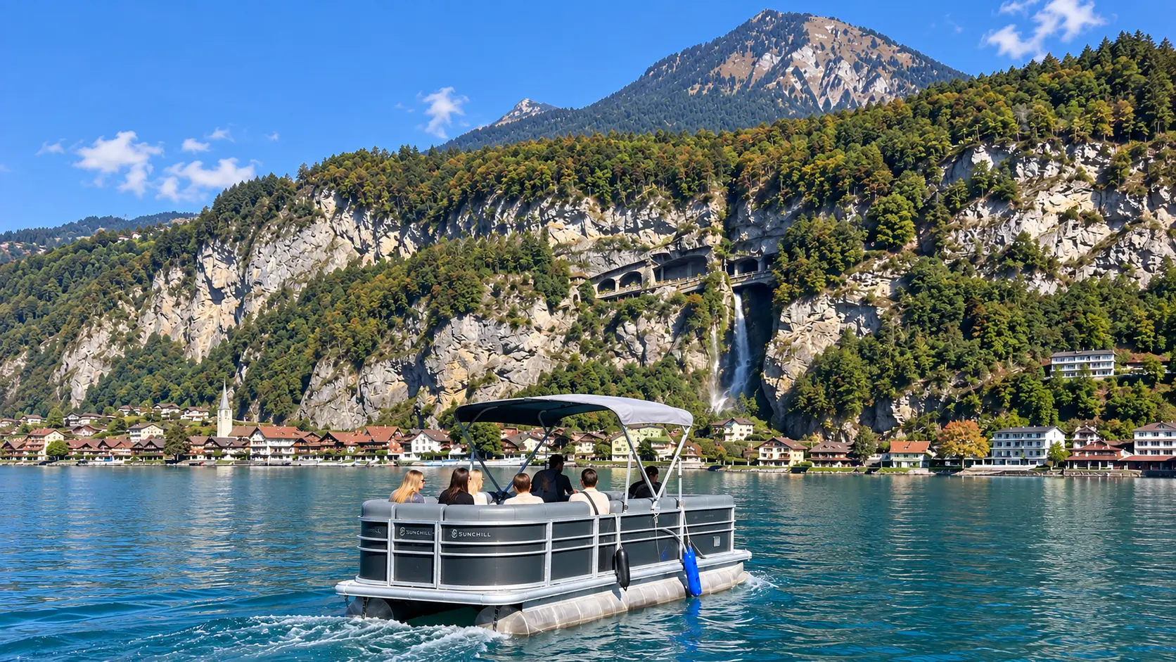 Scenic waterfall viewing from private Lake Thun boat charter
